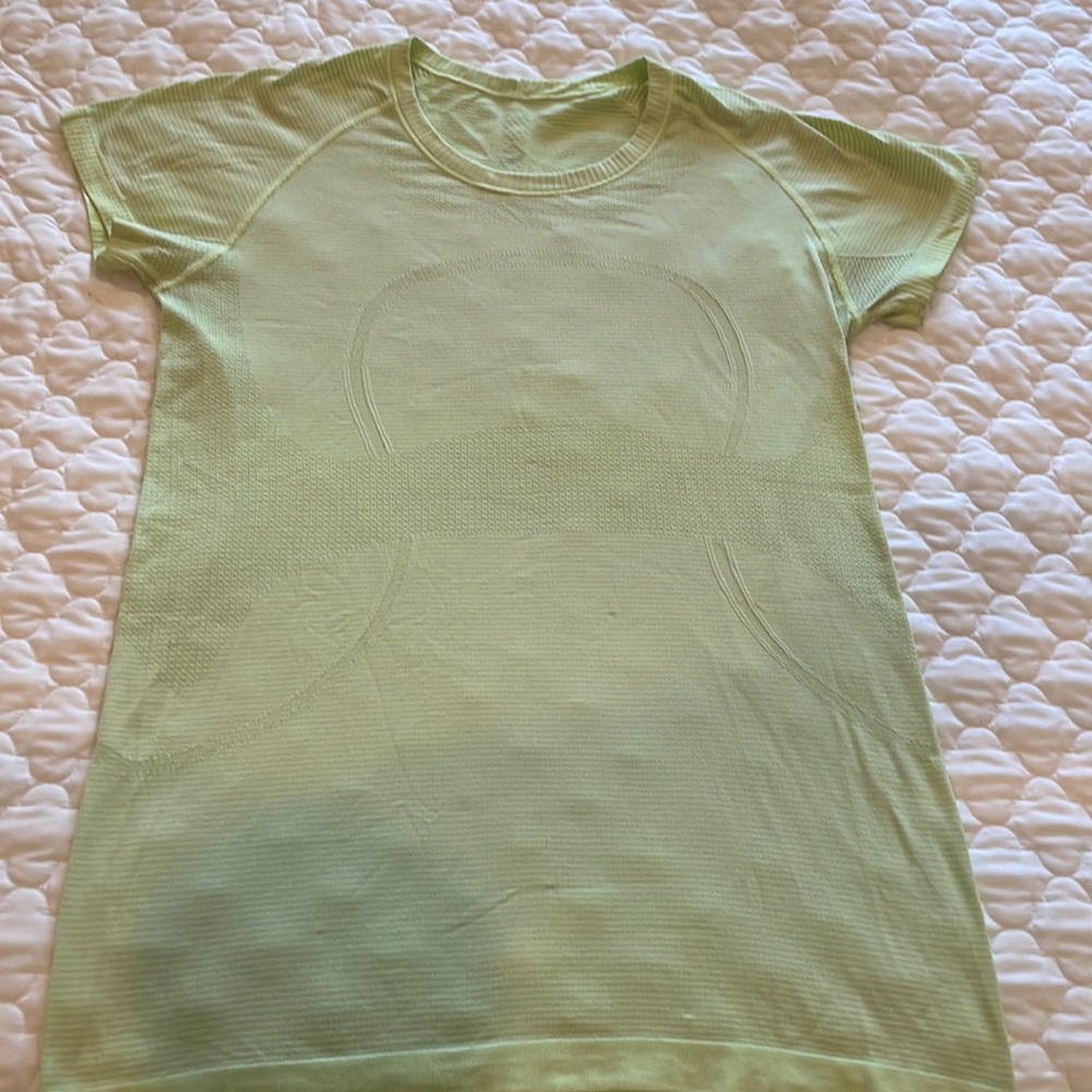 Lululemon athletica lime green swiftly short sleeve size 12. Fair condition